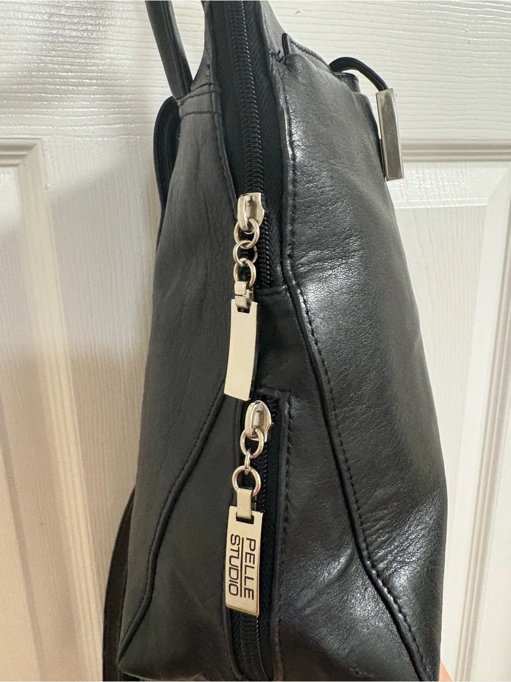 Pelle studios from Wilson leather back pack /organizer. Measures 9 by 9 by 3”